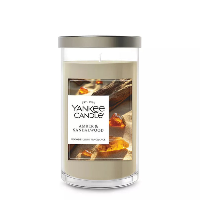 The Yankee Candle Amber &amp; Sandalwood Medium Pillar Candle delivers a deep, warm fragrance that feels both grounding and inviting.
