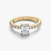 An emerald cut diamond engagement ring set in yellow gold, showcasing a classic and elegant design.