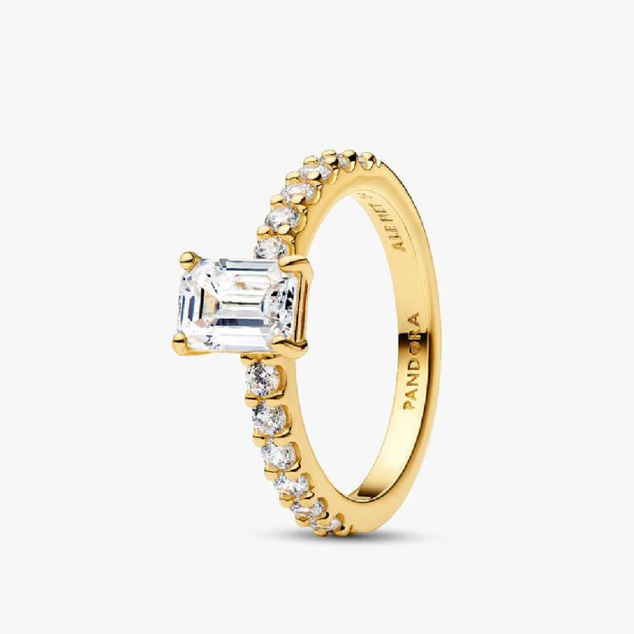 A stunning emerald cut diamond engagement ring crafted in yellow gold, highlighting its timeless beauty.