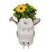 watering can design and small sun flower plant on a white background