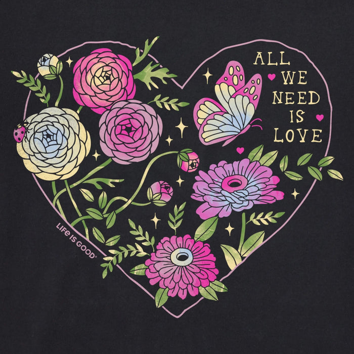 Women's All We Need Is Love & Blooms short sleeve Crusher T-shirt featuring a floral graphic with an inspirational message, crew neckline, and relaxed garment-washed fit for everyday wear.