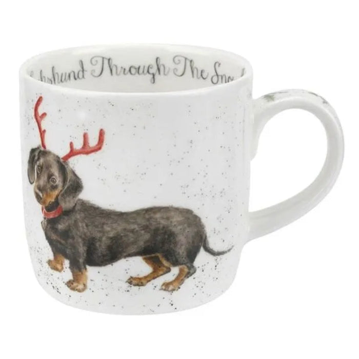 Mug with a dachshund wearing reindeer antlers on a white background