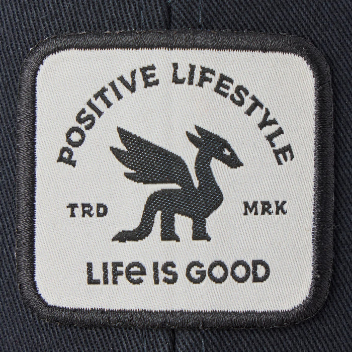 Life Is Good Adult Unisex Positive Lifestyle Dragon Patch Trucker Hat with bold woven dragon patch, structured cotton front, breathable mesh back, low-mid crown, and adjustable snapback closure