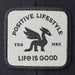 Life Is Good Adult Unisex Positive Lifestyle Dragon Patch Trucker Hat with bold woven dragon patch, structured cotton front, breathable mesh back, low-mid crown, and adjustable snapback closure