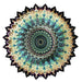 Circular paper pattern featuring a blue and green design, showcasing intricate shapes and vibrant colors.