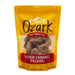 Ozark Nut Roasters Salted Caramel Pecans in a bright yellow resealable stand-up pouch with a clear window showing the pecans inside, on a light gray background.