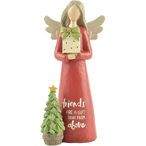 Angel figurine holding a gift with a tree below on a white background