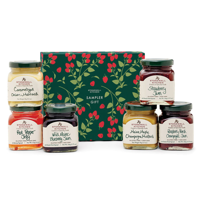 Collection of Stonewall Kitchen jams and jellies with a decorative box on a white background