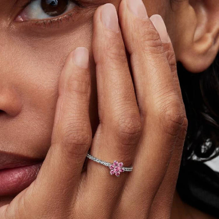 Beautiful Pandora flower ring showcasing a pink sapphire, designed in white gold.