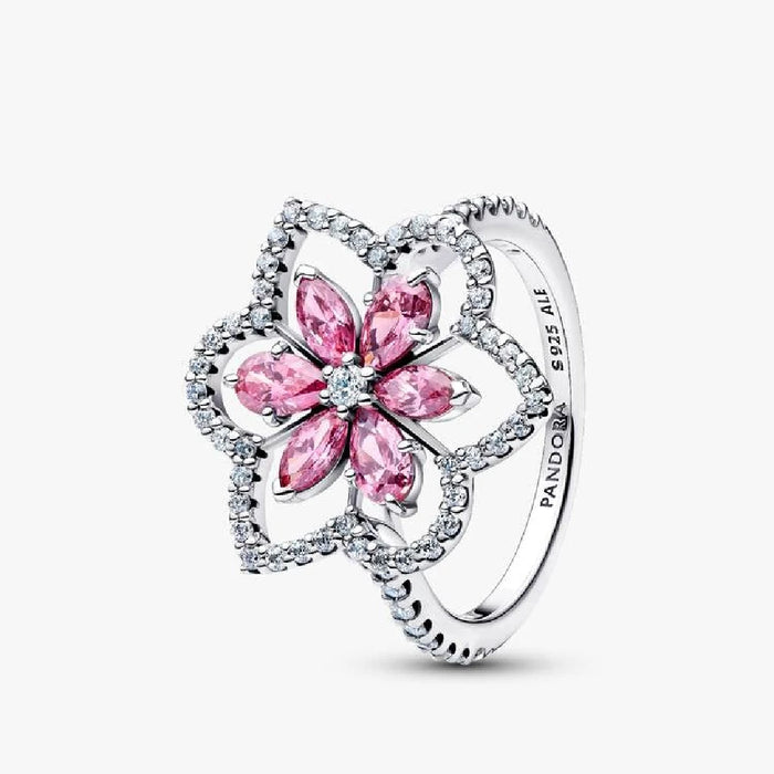 A pink flower ring adorned with diamonds and pink sapphires, showcasing intricate floral design and vibrant colors.