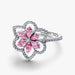 A stunning pink flower ring featuring sparkling diamonds and pink sapphires, elegantly crafted for a luxurious look.