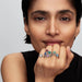 A stunning blue topaz ring adorned with shimmering white diamonds.