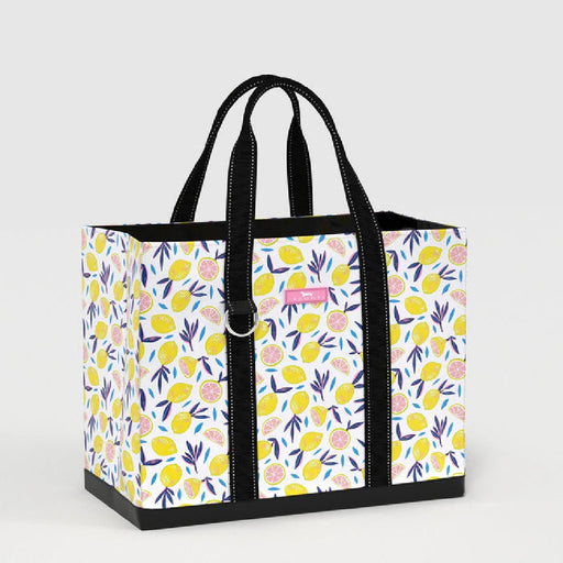 A tote bag featuring a vibrant design of lemons and colorful flowers.