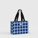 A blue and white checked tote bag with sturdy handles, suitable for shopping or casual outings.