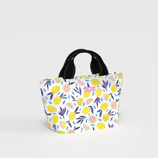 A small white tote bag featuring a vibrant lemon pattern on its surface.
