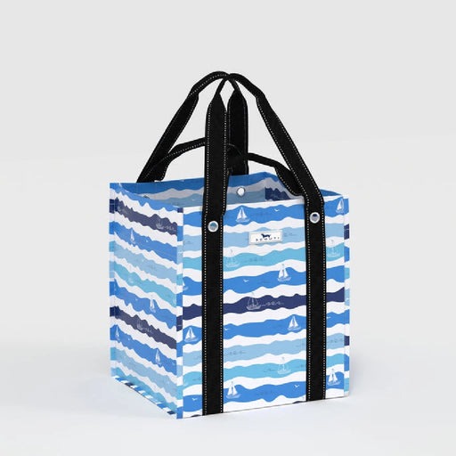 A blue and white striped shopping bag with handles, designed for carrying groceries or personal items.