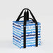 A blue and white striped shopping bag with handles, designed for carrying groceries or personal items.