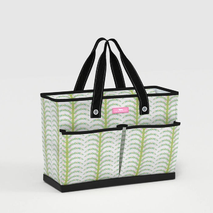 A tote bag featuring a design of green leaves on a light background.