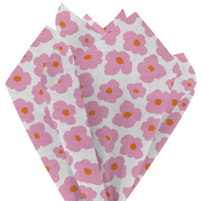 Close‑up of white tissue paper featuring bold pink mod floral pattern