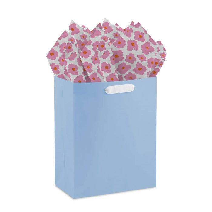 Mod pink flower tissue paper styled in a gift bag