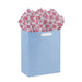 Mod pink flower tissue paper styled in a gift bag