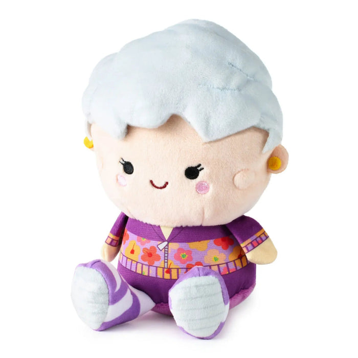Better Together plush of Dorothy Zbornak from “The Golden Girls,” featuring white coiffed hair, purple floral workout outfit, embroidered facial details, weighted body, and embedded magnets