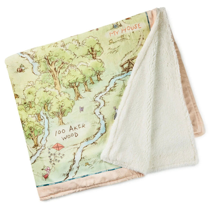 Soft fleece blanket featuring illustrated Hundred Acre Wood map with Winnie the Pooh characters