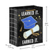 Medium black graduation gift bag with blue cap and gold accents, 7.7" × 9.6" × 4.3"