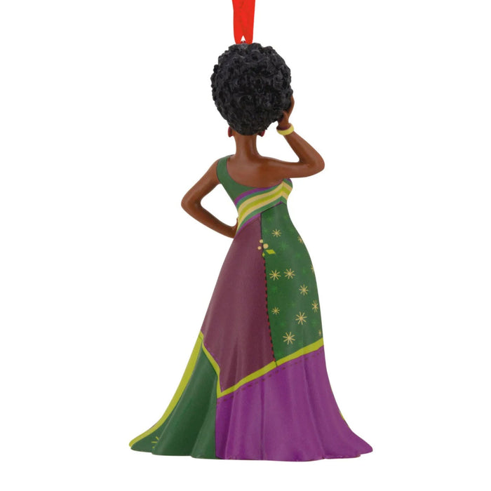 Hallmark ornament featuring a stylish Black woman in a fashionable holiday-inspired design