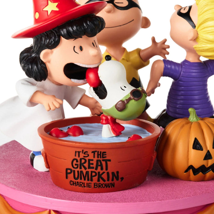 Peanuts It's the Great Pumpkin Charlie Brown Halloween collectible figurine featuring Charlie Brown, Lucy, Linus, Snoopy, and a jack-o'-lantern pumpkin.