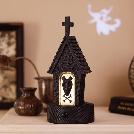 Disney Tim Burton's The Nightmare Before Christmas Zero's Doghouse decoration with built-in light projection, featuring the iconic ghost dog's home
