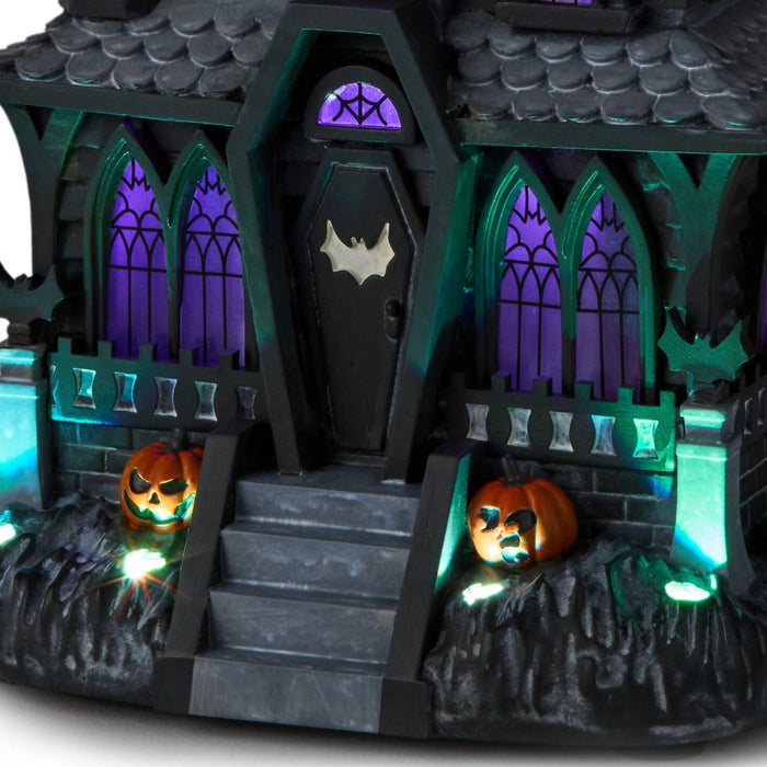 Hauntsville Collection Vampire Manor 9.75-inch Halloween tabletop decoration featuring a gothic haunted mansion with built-in light and spooky sound