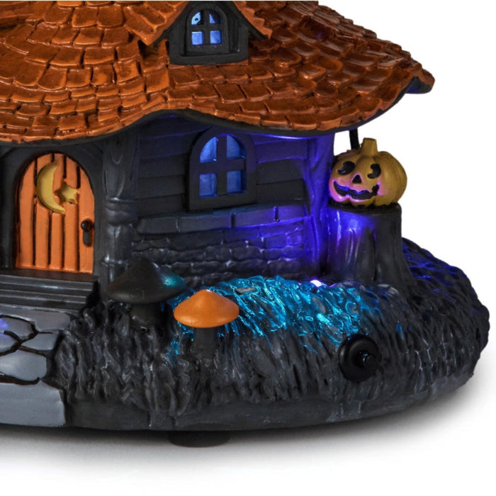 This Hallmark Hauntsville Collection Witch House Tabletop Decoration adds spooky charm and whimsical Halloween style to your seasonal décor.