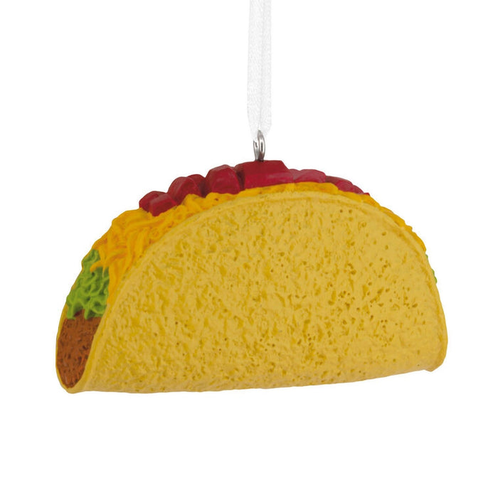 Taco-shaped ornament with visible layers on a white background