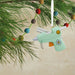 Hallmark Glue Gun Christmas ornament featuring a mint green glue gun design, perfect for DIY enthusiasts, crafters, and creative holiday décor.