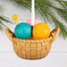 Hallmark Knitting Basket Christmas ornament featuring a resin basket filled with colorful yarn skeins and knitting needles for a cozy holiday display.