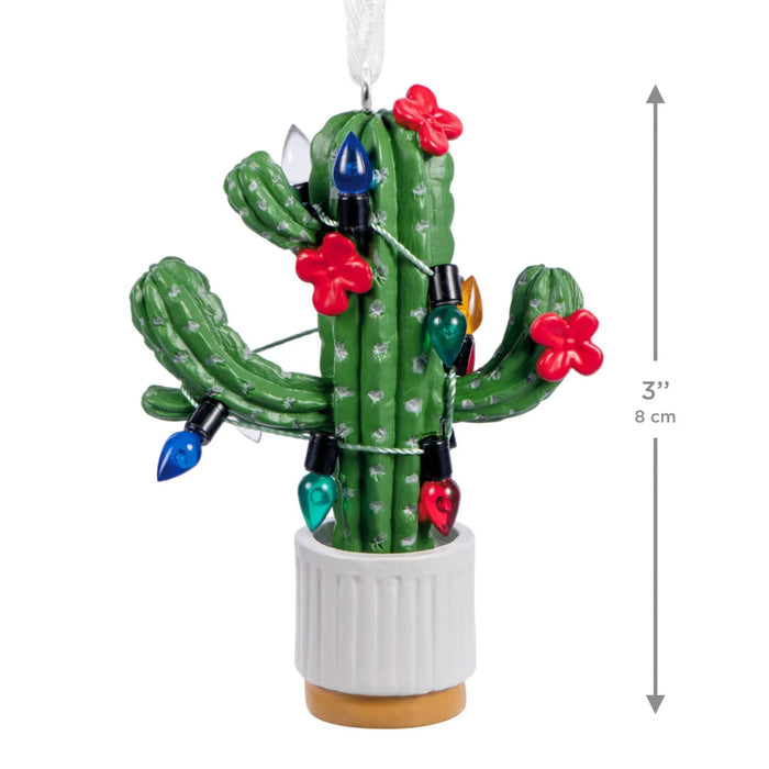 Hallmark Seasonal Cactus Christmas ornament featuring a potted cactus decorated with festive Christmas lights for a desert-inspired holiday display.