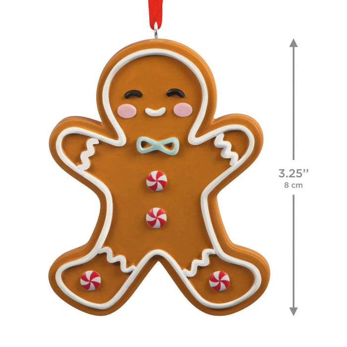 Hallmark Gingerbread Man Cookie Christmas ornament featuring a smiling frosted gingerbread man with peppermint candy buttons and a hanger attachment.