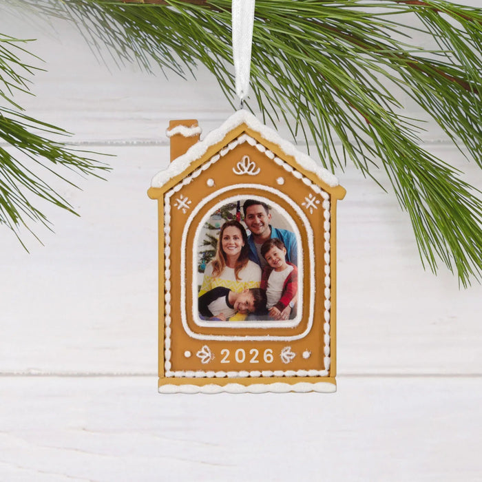 Hallmark Gingerbread House 2026 Photo Frame Christmas ornament featuring a glittery gingerbread house with white frosting accents and a photo holder.
