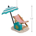 Hallmark Retired and Happy Christmas ornament featuring a beach chair, umbrella, sand, and beach bag with “Retired & Happy” message.