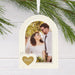 Hallmark Wedding 2026 Christmas ornament featuring a white arched photo frame with a gold heart attachment and year-dated 2026 design for newlyweds.