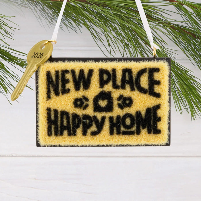 Hallmark New Home 2026 Christmas ornament featuring a resin doormat with “New Place, Happy Home 2026” message and a year-dated house key.