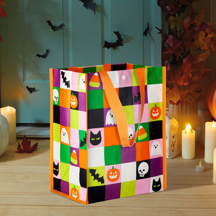 12-inch large reusable Halloween tote bag featuring a colorful grid design with ghosts, candy corn, bats, and black cats, perfect for trick-or-treating, shopping, gifts, and seasonal errands.
