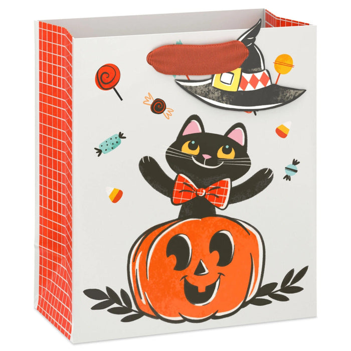 6.5-inch Halloween gift bag featuring a cute black cat sitting inside a smiling jack-o'-lantern pumpkin with a matching gift tag, perfect for candy, treats, party favors, and small Halloween gifts.