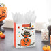 6.5-inch Halloween gift bag featuring a cute black cat sitting inside a smiling jack-o'-lantern pumpkin with a matching gift tag, perfect for candy, treats, party favors, and small Halloween gifts.