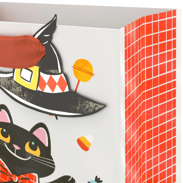 6.5-inch Halloween gift bag featuring a cute black cat sitting inside a smiling jack-o'-lantern pumpkin with a matching gift tag, perfect for candy, treats, party favors, and small Halloween gifts.