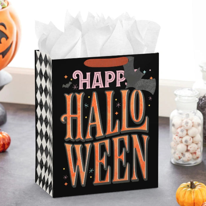 This Hallmark 13" Orange Letters with Bats on Black Large Halloween Gift Bag With Gift Tag makes Halloween gift-giving fun, festive, and effortless. 