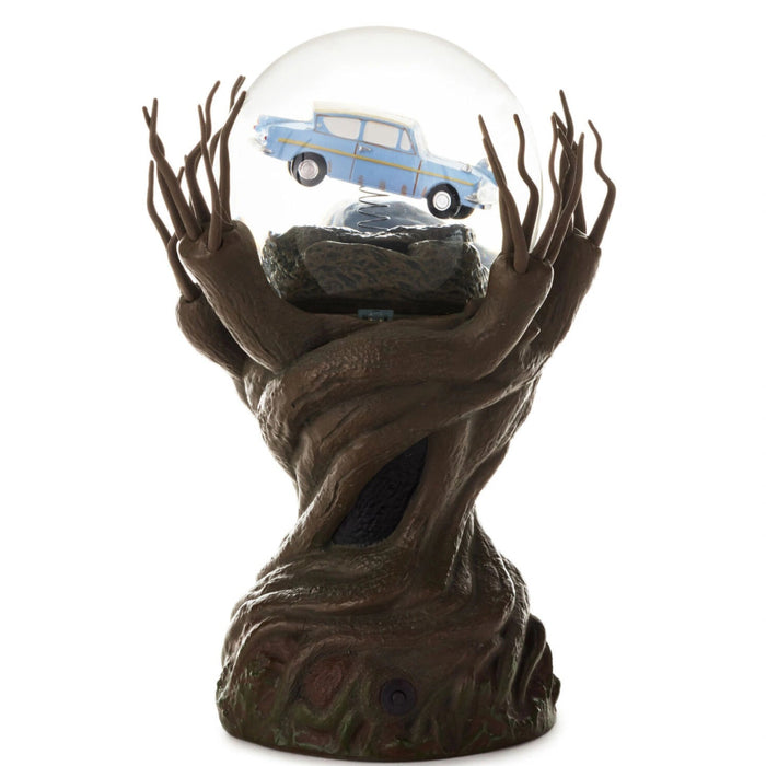 Harry Potter Whomping Willow snow globe featuring illuminated LED lighting, animated motion, swirling glitter, and a detailed magical tree scene inspired by the Wizarding World.