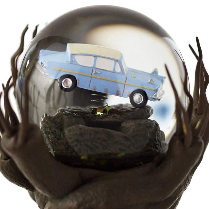 Harry Potter Whomping Willow snow globe featuring illuminated LED lighting, animated motion, swirling glitter, and a detailed magical tree scene inspired by the Wizarding World.