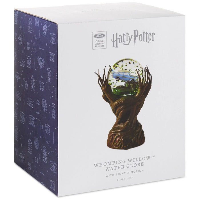 Harry Potter Whomping Willow snow globe featuring illuminated LED lighting, animated motion, swirling glitter, and a detailed magical tree scene inspired by the Wizarding World.